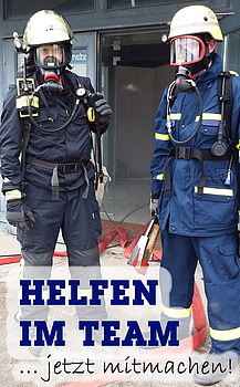 Feuerwehrmann und THW Helfer unter Atemschutz